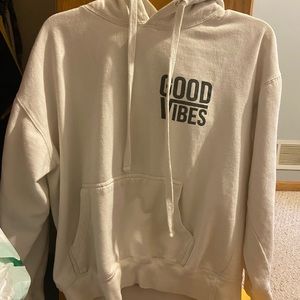 White hoodie that says good vibes
